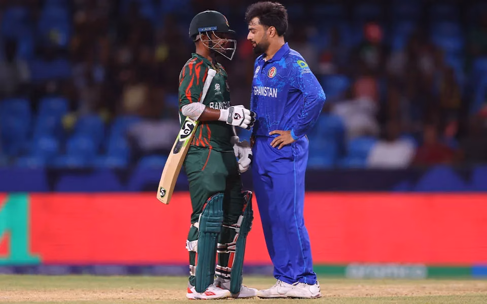 Bangladesh and Afghanistan cricket players standing together at the center of a stadium before their Asia Cup 2025 match.